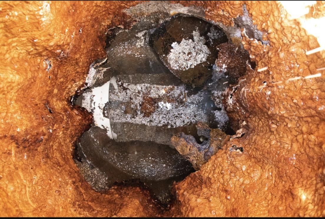 A failed spray-on epoxy coating inside a Texas manhole